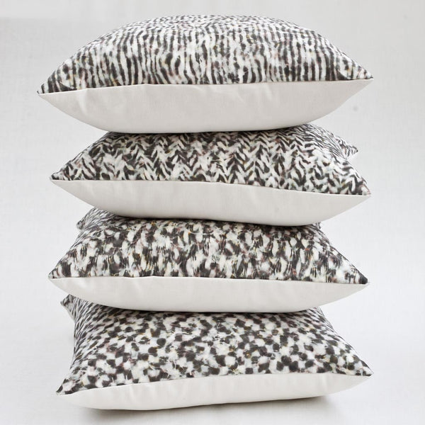 Carley Kahn pillow covers. Four of them stacked. Rose and gold colorway. 