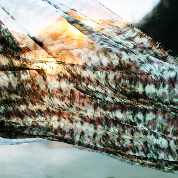 Carley Kahn "Wahkeena Falls" silk scarf blowing in wind at sunset. 