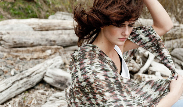 Carley Kahn "Wahkeena Falls" silk scarf. Model wears scarf as it blows in wind, along with her hair. 